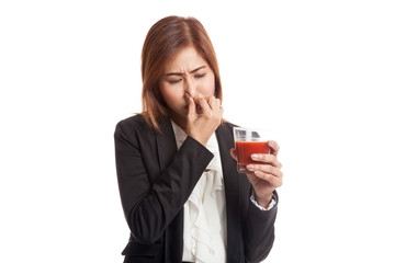 Fototapeta premium Young Asian business woman hate tomato juice