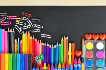 Various School supply on blackboard, Colourful office supply