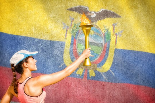 Composite image of rear view of happy sportswoman holding a cup 