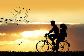 couple on bicycle at sunset