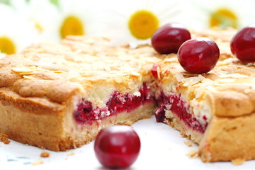 Homemade pie with cherries on table