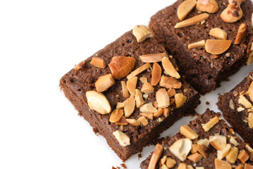 Many pieces of brownie on white background - isolated