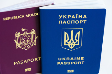 Friendship of nations: Ukrainian passport and the passport of Moldova close up on a white background