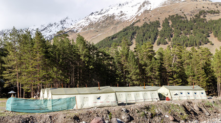 military camp with tents in the mountains