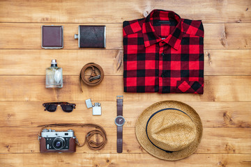 Travel concept shirt, camera, hat, flask, watch, eyeglasses, bel