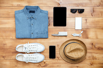 Travel concept shoes, shirt, mobile phone, mp3, usb, eyeglasses,