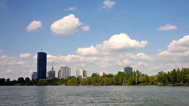Skyline of the Danube City at  Danube Island seen from the Danube river. The is Island one of the most interesting extensive public recreation area. The DC-Tower is the tallest skyscraper in Austria.