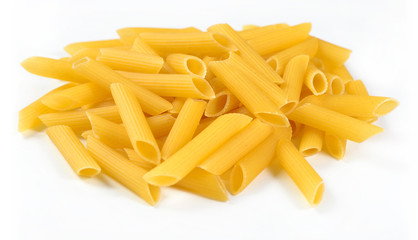 Heap of uncooked italian pasta penne on a white