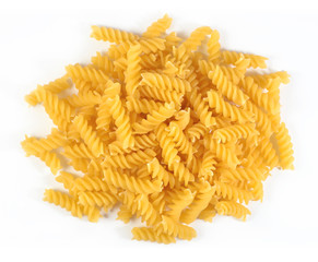 Heap of uncooked italian pasta fusilli on a white