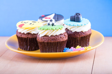 Delicious cupcakes on table