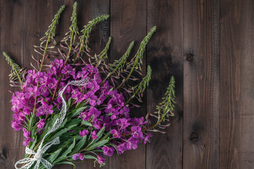 Fireweed flowers fresh on a wooden boards background