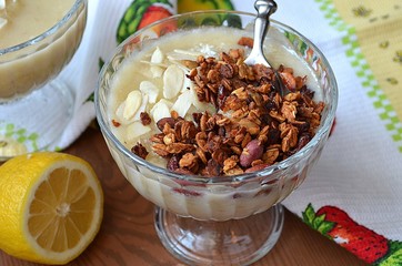 Dessert with banana, coconut milk and muesli