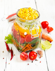Prepared for canning colorful vegetables in glass jar with clip © Nataliia Pyzhova