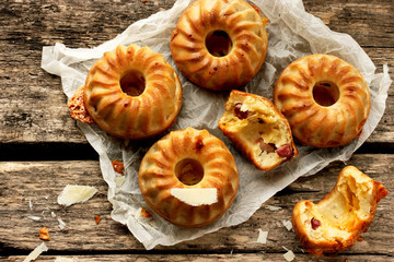 Cheesy breakfast muffins in rustic style