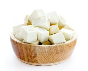 Tofu cubes in wooden bowl