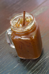 Iced Americano on wood table.