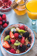 cereal bowl with fresh mixed fruits, overhead