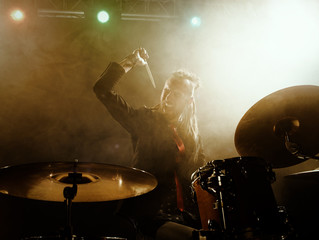 Fototapeta na wymiar Silhouette of the drummer on stage.