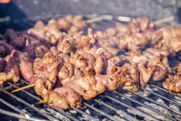 meat kebab skewers on the grill, chicken hearts,
