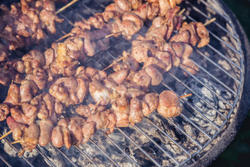 meat kebab skewers on the grill, chicken hearts,
