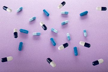 Heap of medicine blue capsules and pills