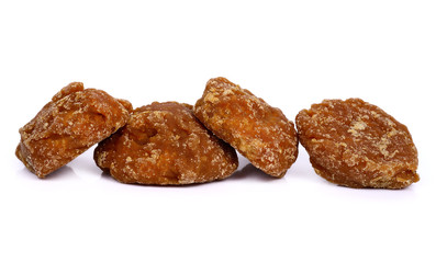 coconut flower sugar blocks on white background.