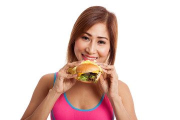Beautiful Asian healthy girl enjoy eating  hamburger