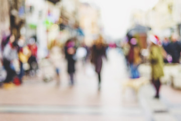 abstract blurred background of people walking in city center - obrazy, fototapety, plakaty