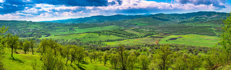 Apple and plum orchards and farmland in spring colors