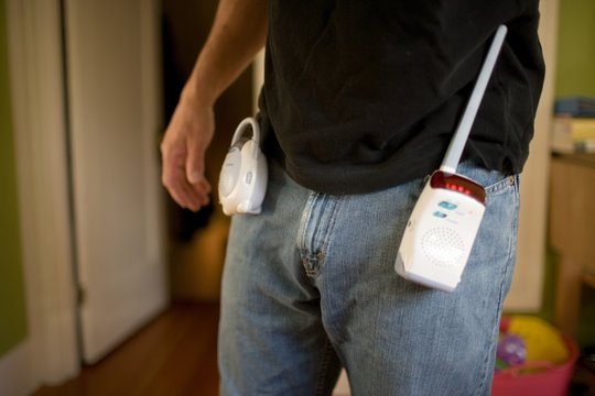 Man with baby monitor attached to jeans