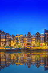 Fototapeta premium Amstel river, canals and night view of beautiful Amsterdam city. Netherlands