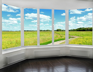 window overlooking the summer field and country road