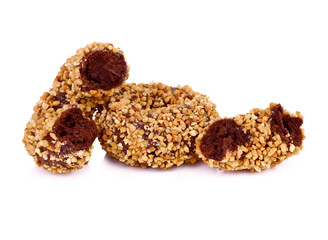  peanut covered donuts over white.