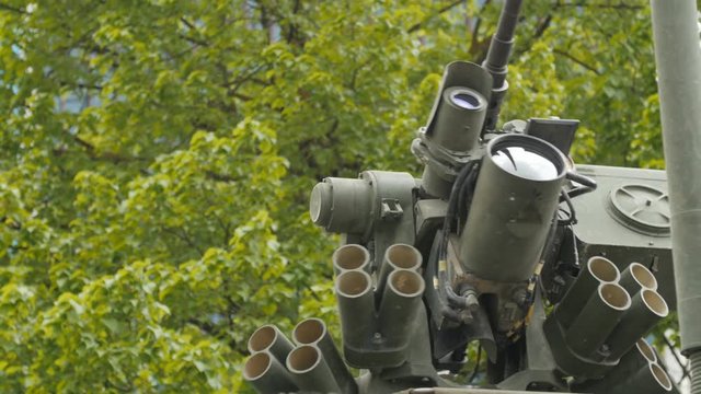 Close up view of the turret, armaments and gun of an operational military armored tank vehicle.
