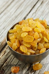 Dried Golden Raisins in a bowl, selective focus