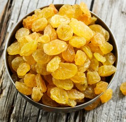 Dried Golden Raisins in a bowl, selective focus