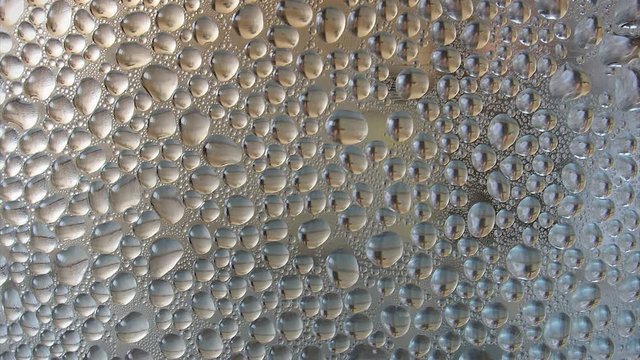 Water drops at transparent surface, zoom in HD video
