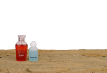 Shampoo and Liquid soap on wood with copy space and  white backg