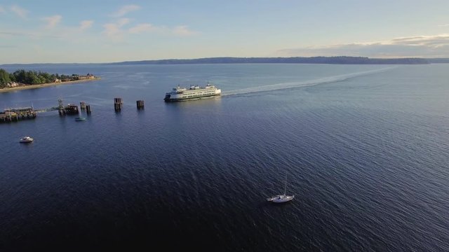 West Seattle, Washington Aerial Southworth to Fauntleroy Ferry Arrival to Dock Terminal Time-lapse in Puget Sound