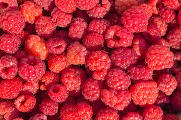 Fresh raspberries on beautiful background closeup photo