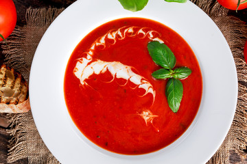 Smooth and sweet tomato soup, seasoned with basil, garlic.