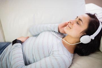High angle view of woman listening to music