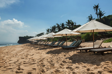 Balangan beach with parasol, Nusa Dua, is one of the most beautiful in Bali, it is called Mars at its bottom is covered with volcanic rock.