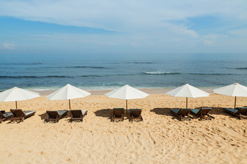 Balangan beach with parasol, Nusa Dua, is one of the most beautiful in Bali, it is called Mars at its bottom is covered with volcanic rock.