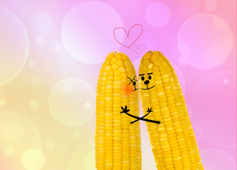 couple corn in love with pink bokeh background