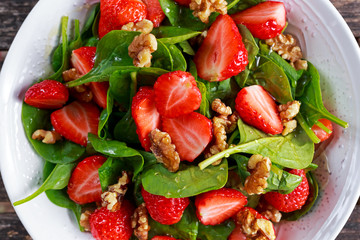 Summer Fruit Vegan Spinach Strawberry nuts Salad. concepts health food