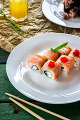 Rolls on white plate and beverage.