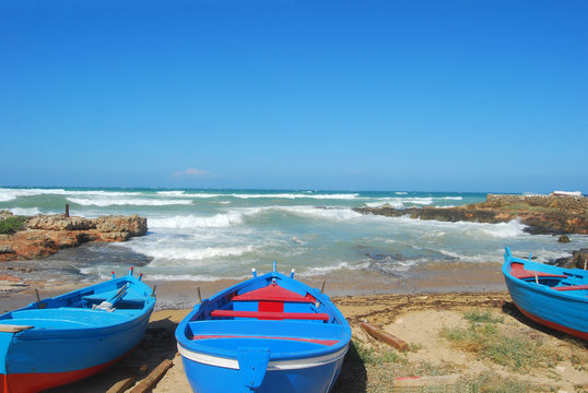 Boats ashore on the coast of Apulia of Torre Canne - Puglia - It