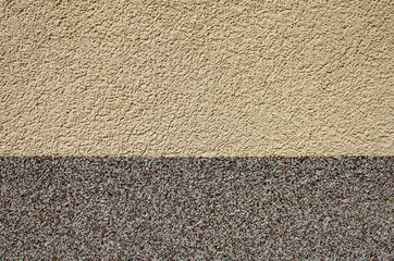 Two-colored plaster as a background, beige and gray plaster wall, horizontal background