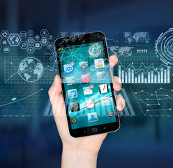 Businesswoman using digital mobile phone charts interface